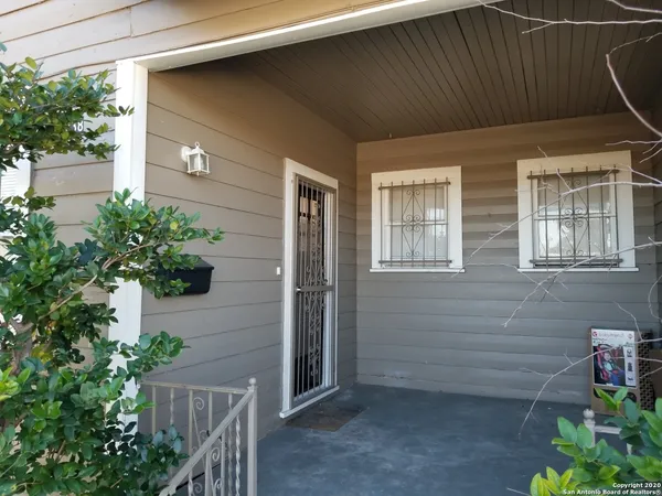 a view of backyard with potted plants