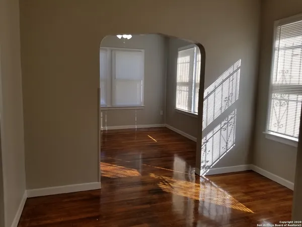 a view of an entryway with wooden floor