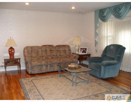 10 Phillips Road Edison, NJ 08817 - Photo 2 of 9 a living room with furniture and a potted plant