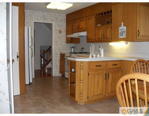 10 Phillips Road Edison, NJ 08817 - Photo 6 of 9 a kitchen with stainless steel appliances granite countertop a stove a sink and a cabinets