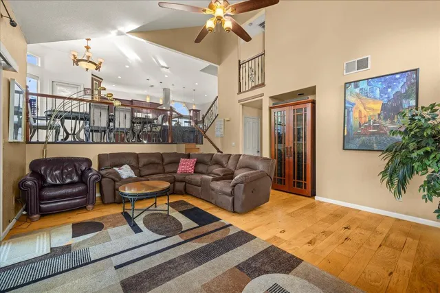 a living room with furniture and a potted plant