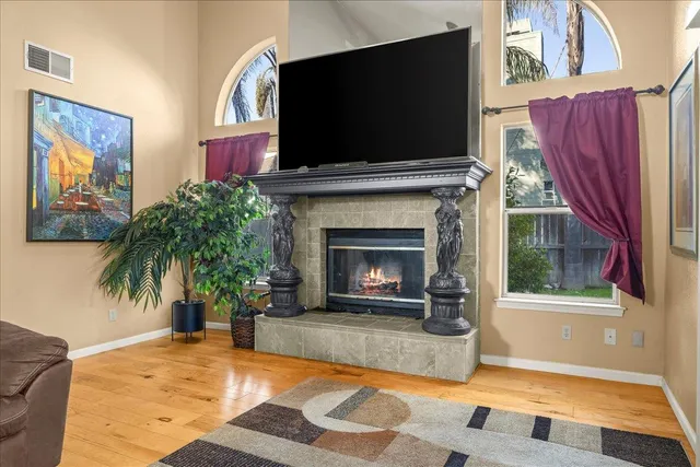 a living room with furniture and a fireplace