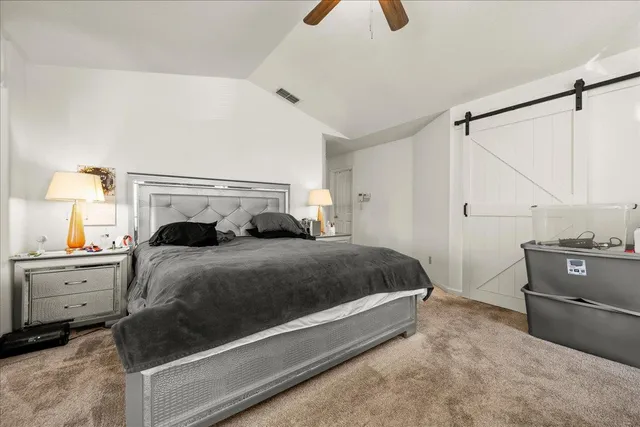 a view of living room with furniture and mirror