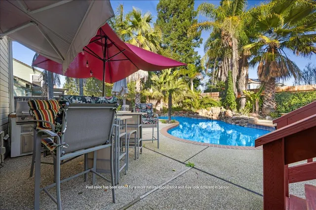 a view of a two chairs in the balcony