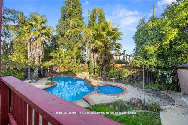 a view of a house with roof deck and sitting area