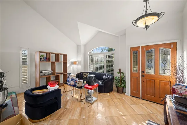 a living room with furniture and a large window
