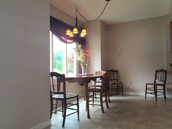 610 County Road, Unit 4 Holyoke, MA 01040 - Photo 3 of 21 a view of a dining room with furniture window and chandelier