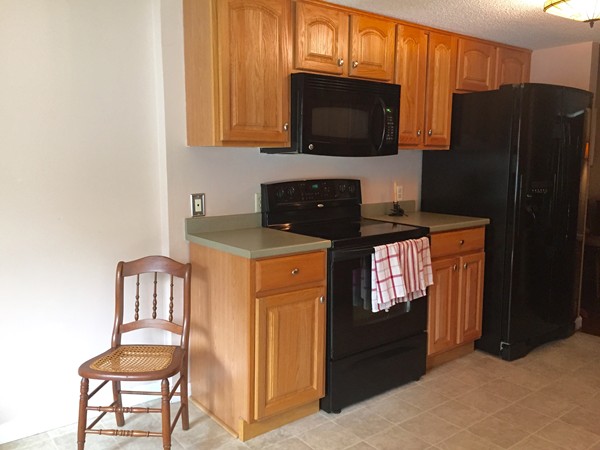 610 County Road, Unit 4 Holyoke, MA 01040 - Photo 5 of 21 a kitchen with stainless steel appliances granite countertop a refrigerator stove and microwave