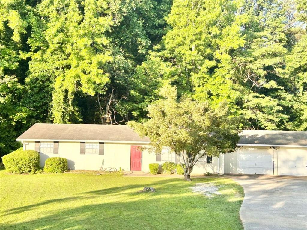 4363 Stonewall Tell Road Atlanta, GA 30349 - Photo 1 of 1 a view of an outdoor space and a yard