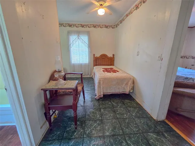 a bedroom with a bed and a table in it