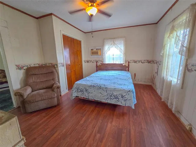 a bedroom with a bed and a couch