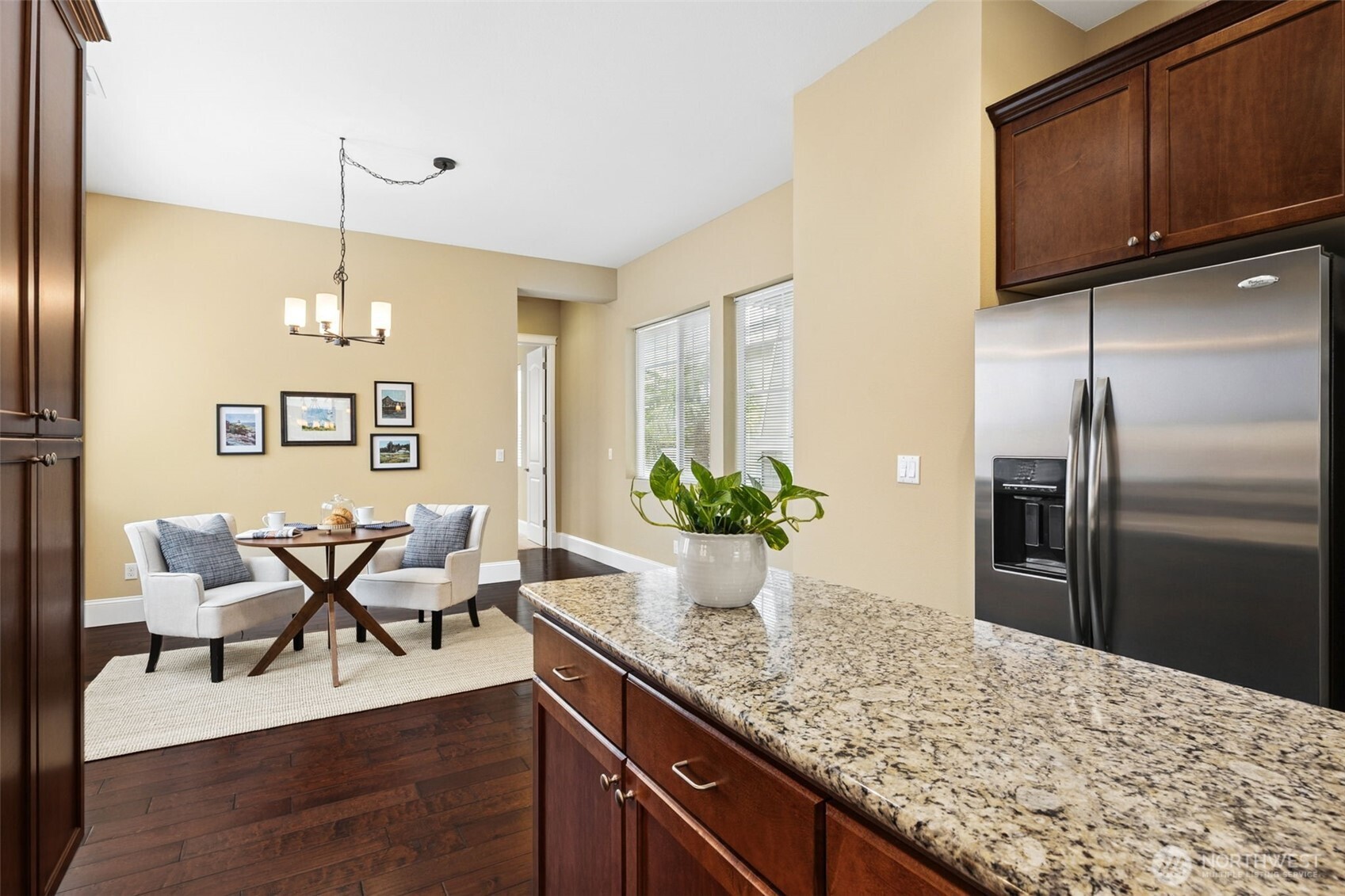 8265 Orcas Loop Northeast Lacey, WA 98516 - Photo 14 of 40 a view of kitchen with sink refrigerator dining table and chairs