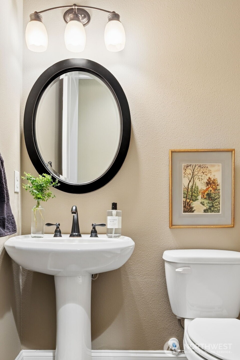 8265 Orcas Loop Northeast Lacey, WA 98516 - Photo 19 of 40 a bathroom with a toilet a sink and a mirror