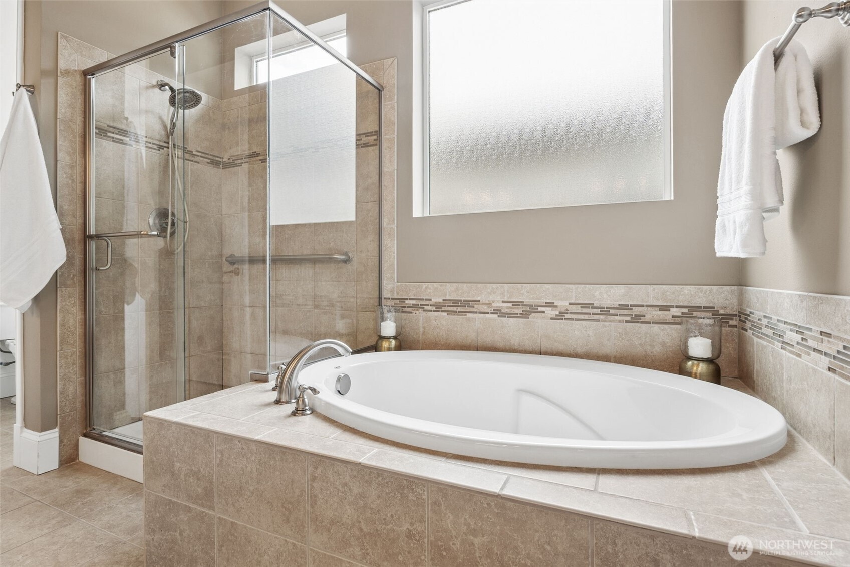 8265 Orcas Loop Northeast Lacey, WA 98516 - Photo 24 of 40 a bath tub sitting next to a bathroom