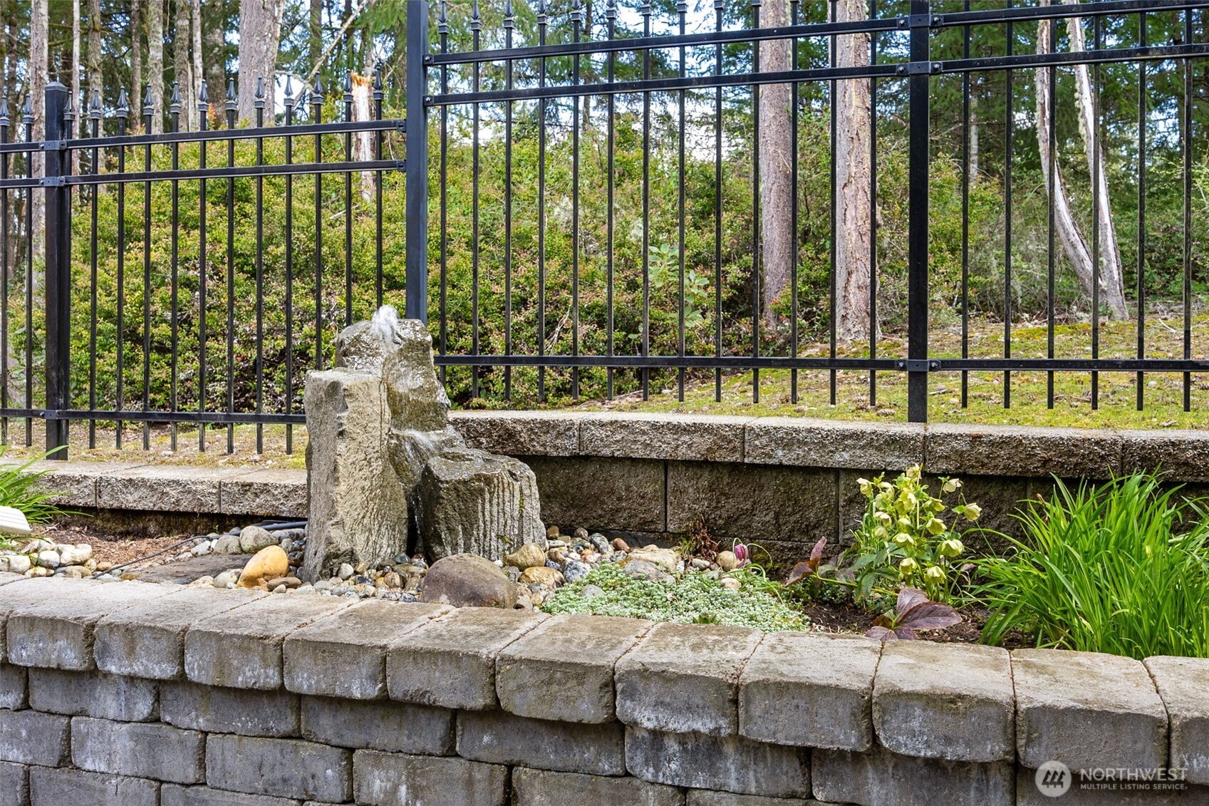 8265 Orcas Loop Northeast Lacey, WA 98516 - Photo 30 of 40 a view of a water fountain and potted plants