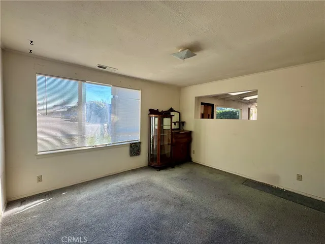 a room with window and furniture
