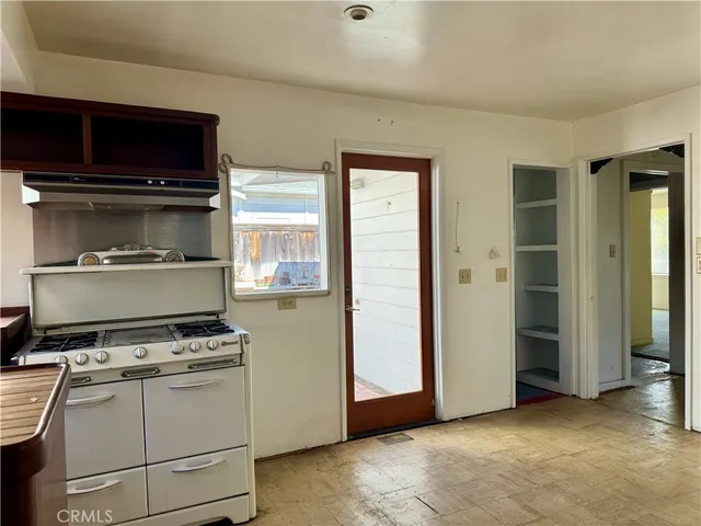 a kitchen with a stove and a microwave