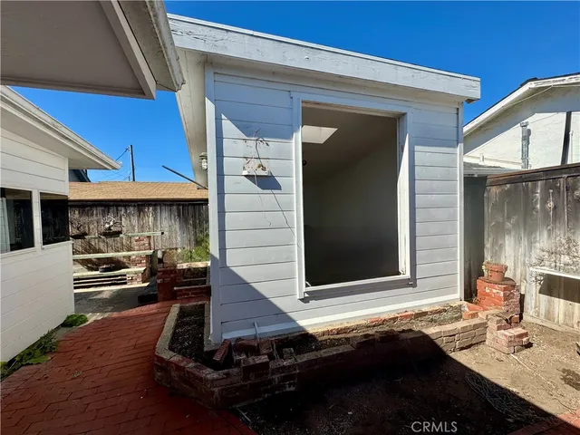 a view of a balcony with wooden floor