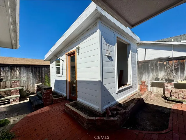 a backyard of a house with seating space