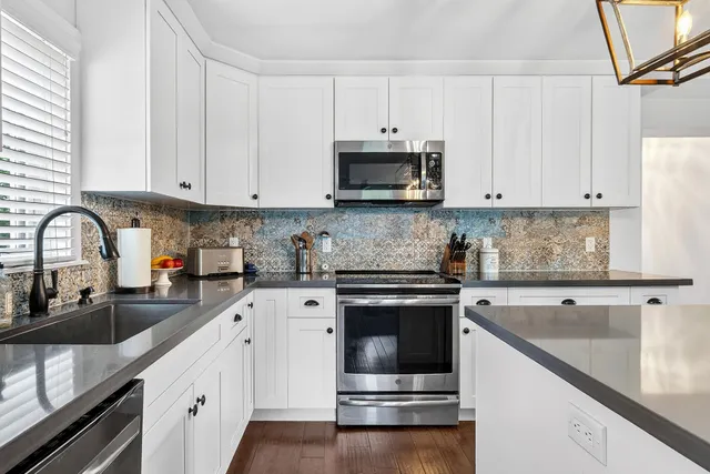 a bathroom with a sink vanity and a mirror