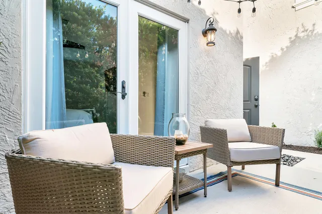 a front view of a house with a yard and a garage