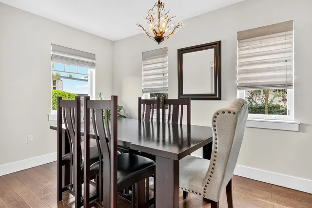 a kitchen with stainless steel appliances granite countertop a sink a stove and cabinets