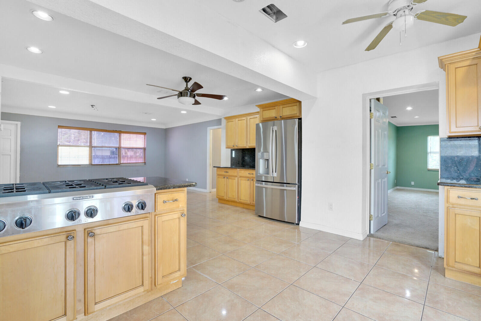 3230 Buccaneer Road Lake Worth, FL 33462 - Photo 14 of 24 a kitchen with a stove a refrigerator and a sink