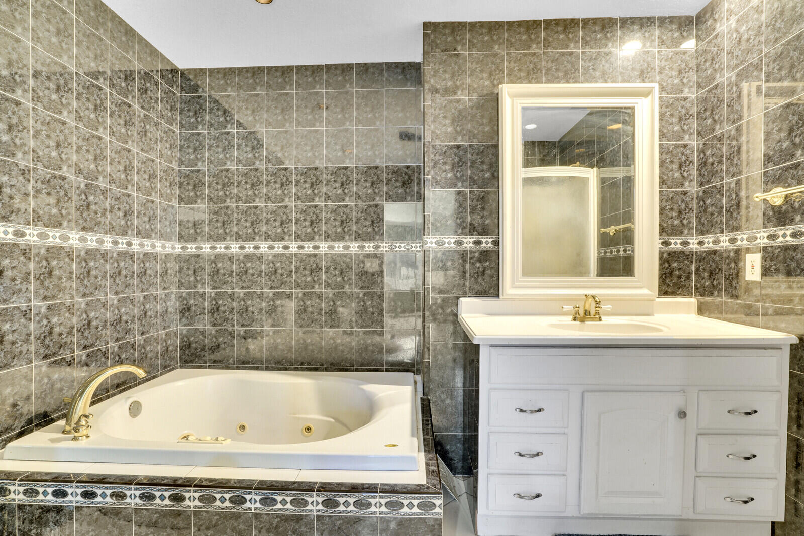 3230 Buccaneer Road Lake Worth, FL 33462 - Photo 17 of 24 a bathroom with a bathtub and sink