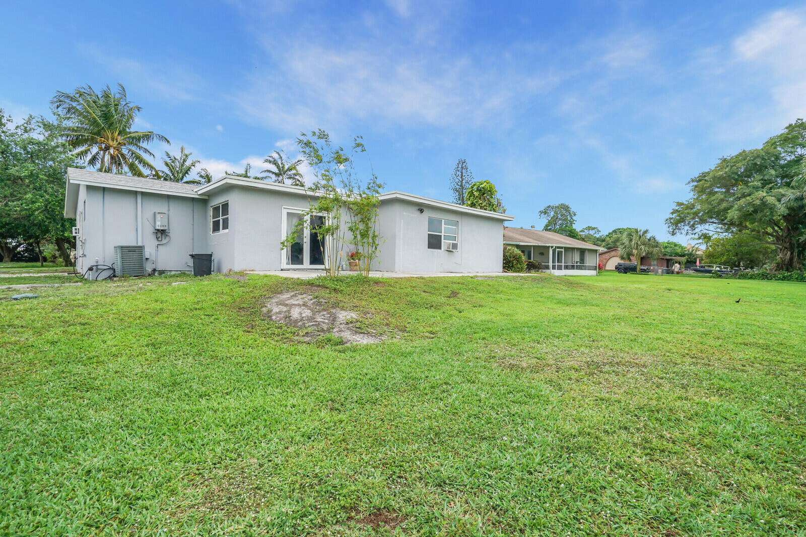 3230 Buccaneer Road Lake Worth, FL 33462 - Photo 22 of 24 a view of a house with a yard and sitting area