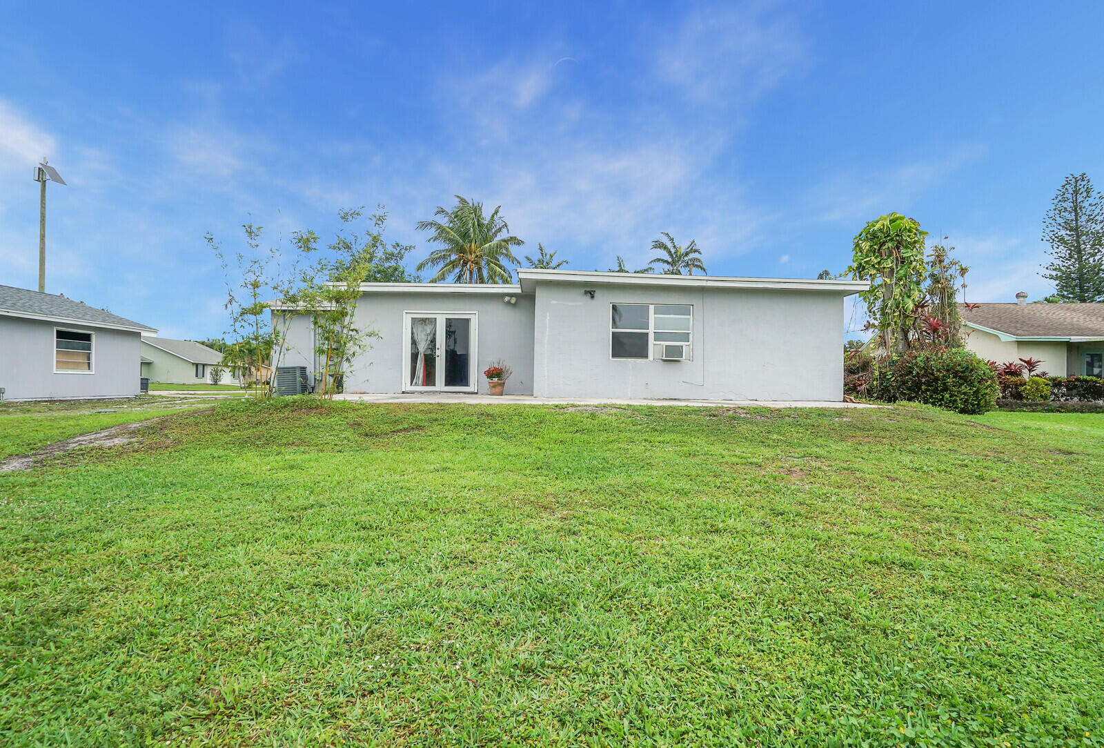 3230 Buccaneer Road Lake Worth, FL 33462 - Photo 23 of 24 a front view of house with yard and trees