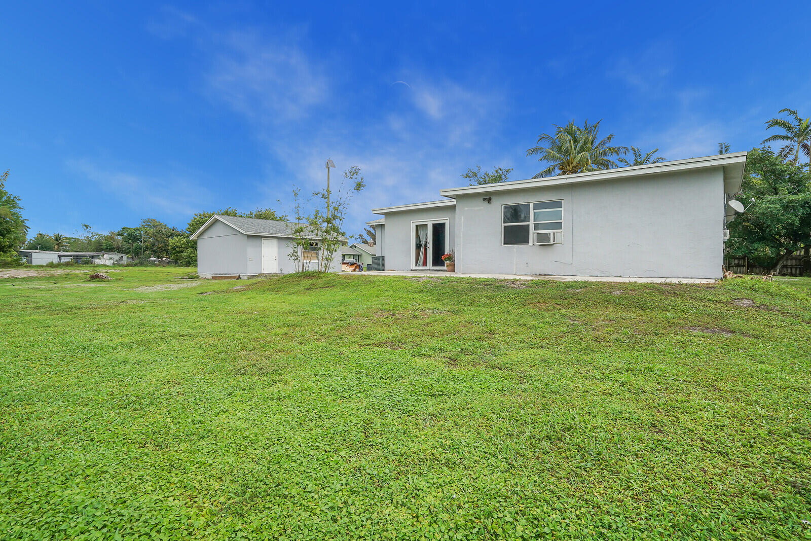 3230 Buccaneer Road Lake Worth, FL 33462 - Photo 24 of 24 a house with a yard