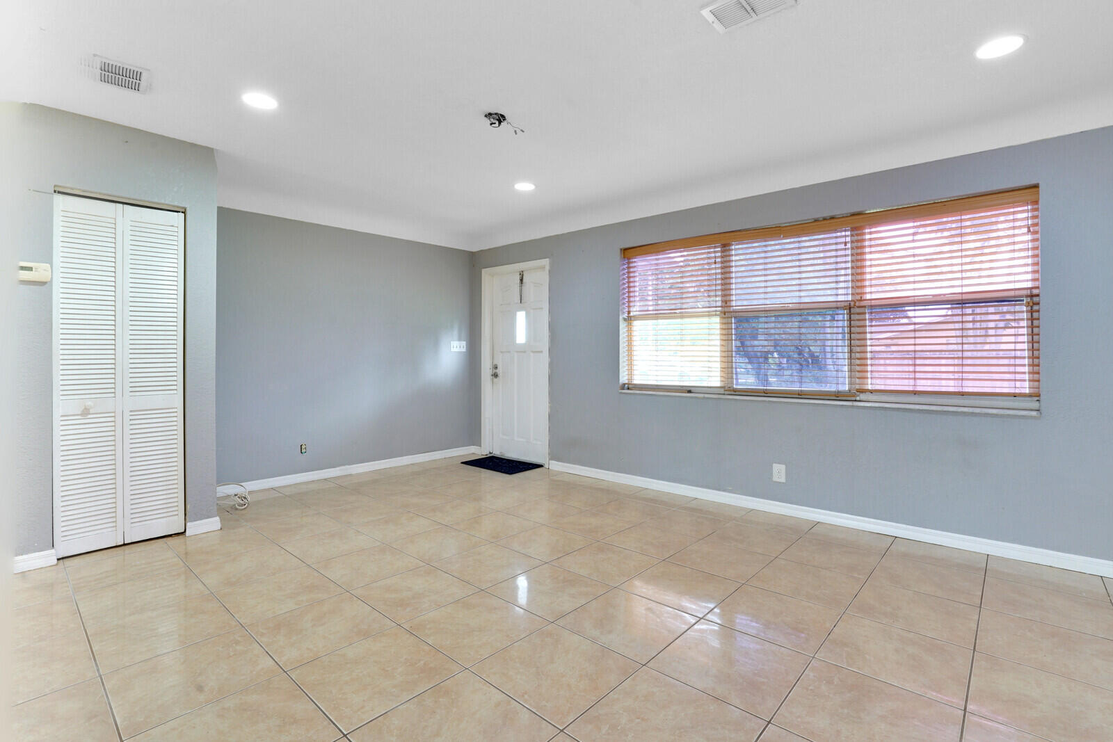 3230 Buccaneer Road Lake Worth, FL 33462 - Photo 8 of 24 a view of an empty room with a window