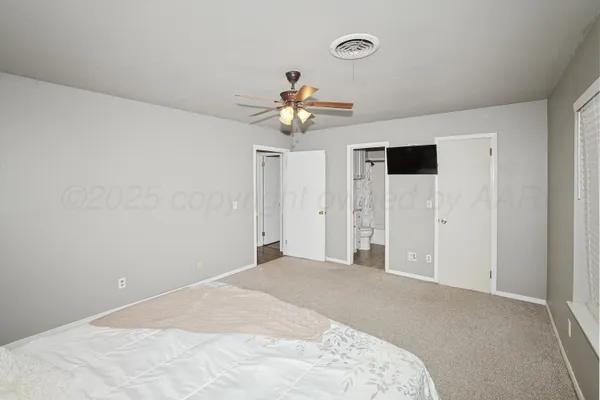 a view of a chandelier fan in a room