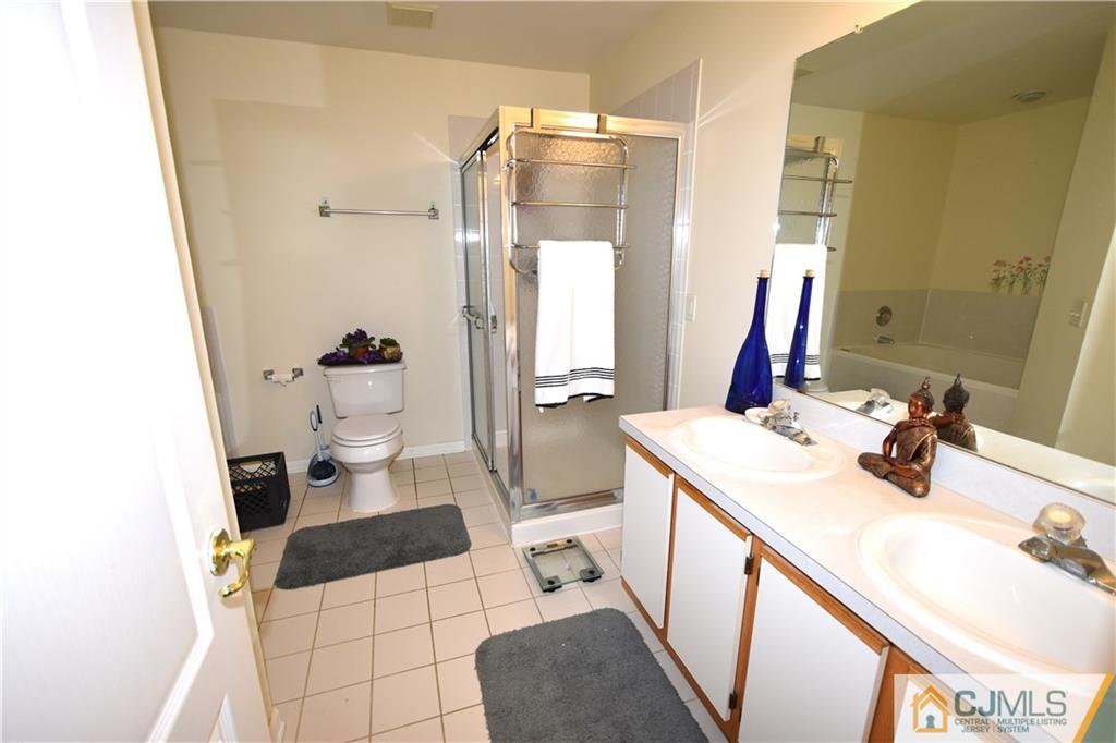 248 Hawthorne Road North Brunswick, NJ 08902 - Photo 12 of 24 a bathroom with a sink and a mirror