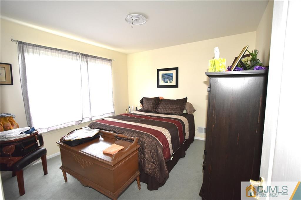 248 Hawthorne Road North Brunswick, NJ 08902 - Photo 14 of 24 a bedroom with bed and window