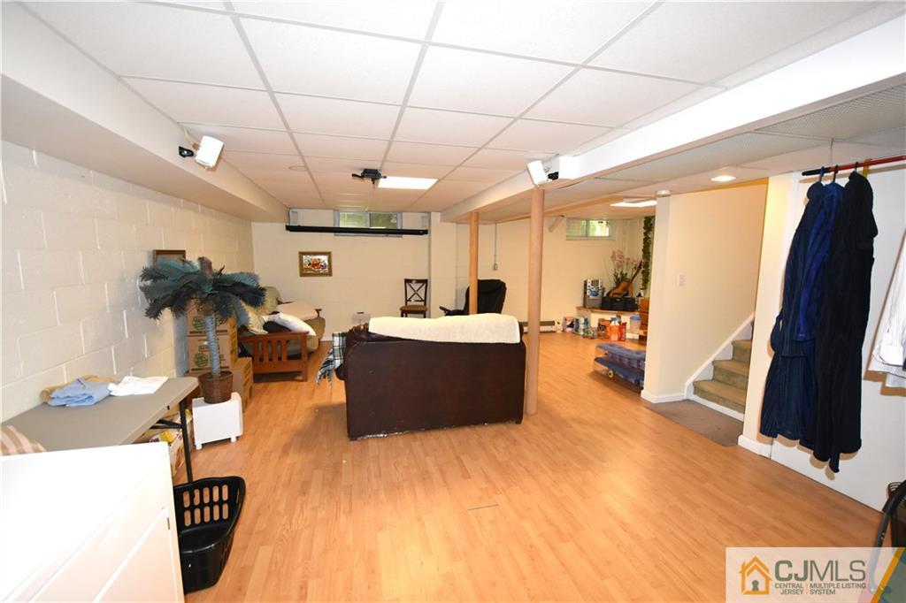 248 Hawthorne Road North Brunswick, NJ 08902 - Photo 15 of 24 a large room with gym equipment and a large window