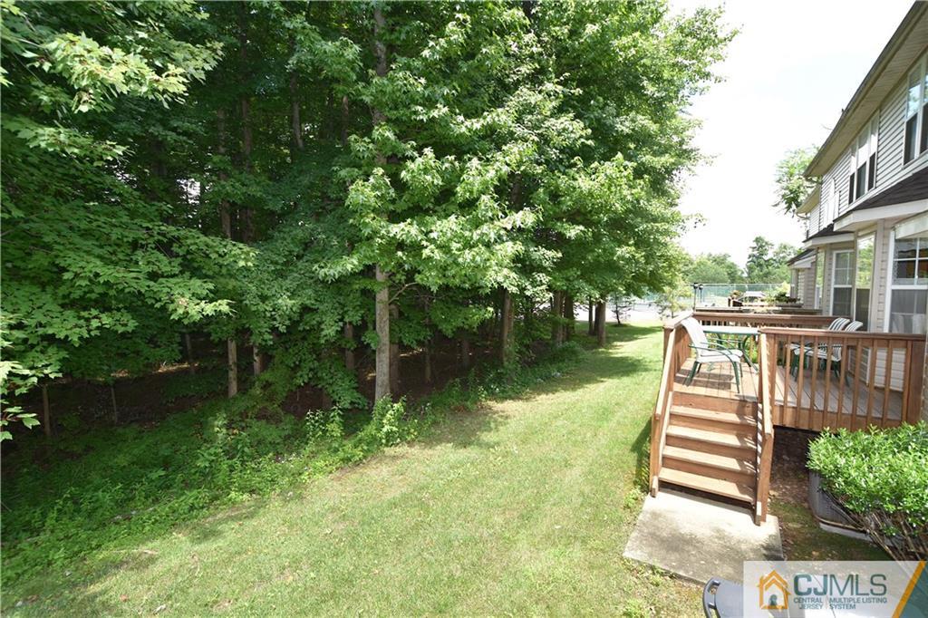 248 Hawthorne Road North Brunswick, NJ 08902 - Photo 18 of 24 a view of a lake with a house in the background
