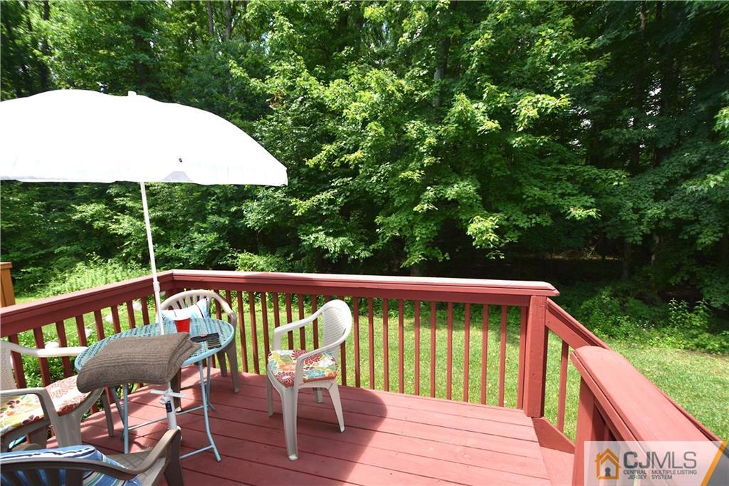 248 Hawthorne Road North Brunswick, NJ 08902 - Photo 20 of 24 a view of a chair and table on the wooden floor