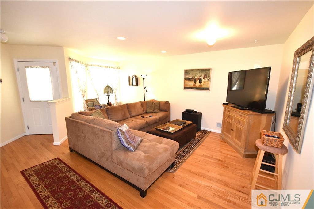 248 Hawthorne Road North Brunswick, NJ 08902 - Photo 3 of 24 a living room with furniture and a flat screen tv