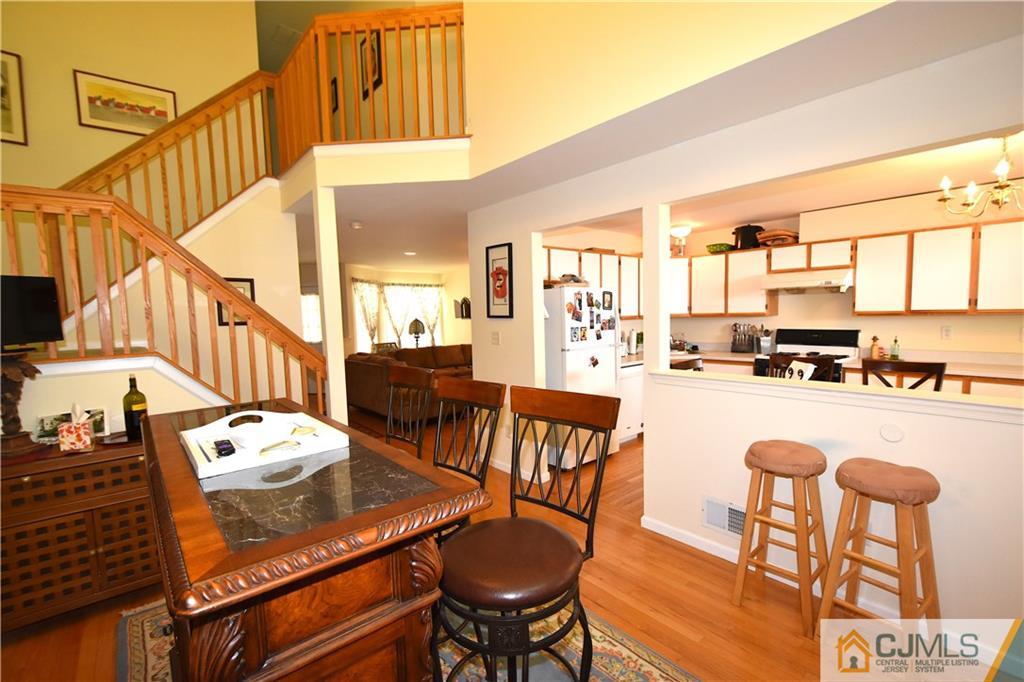 248 Hawthorne Road North Brunswick, NJ 08902 - Photo 5 of 24 a dining room with furniture and a kitchen view