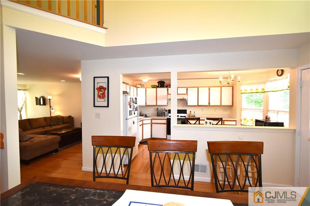 248 Hawthorne Road North Brunswick, NJ 08902 - Photo 8 of 24 a living room with furniture a flat screen tv and a large window