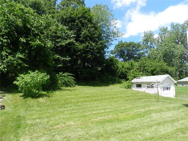 196 Pasco Road Springfield, MA 01151 - Photo 16 of 19 a white house with green field