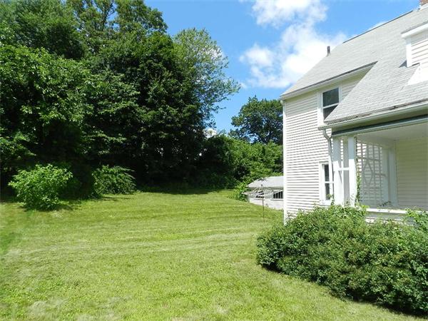 196 Pasco Road Springfield, MA 01151 - Photo 18 of 19 a backyard of a house with plants and large trees