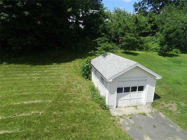 196 Pasco Road Springfield, MA 01151 - Photo 4 of 19 a house with green field in front of it