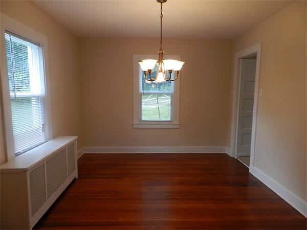 196 Pasco Road Springfield, MA 01151 - Photo 5 of 19 a view of a room with wooden floor and windows