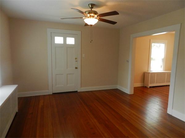 196 Pasco Road Springfield, MA 01151 - Photo 6 of 19 an empty room with wooden floor and windows