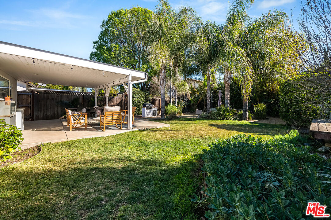 6660 Amigo Avenue Reseda, CA 91335 - Photo 11 of 25 a swimming pool with outdoor seating and yard