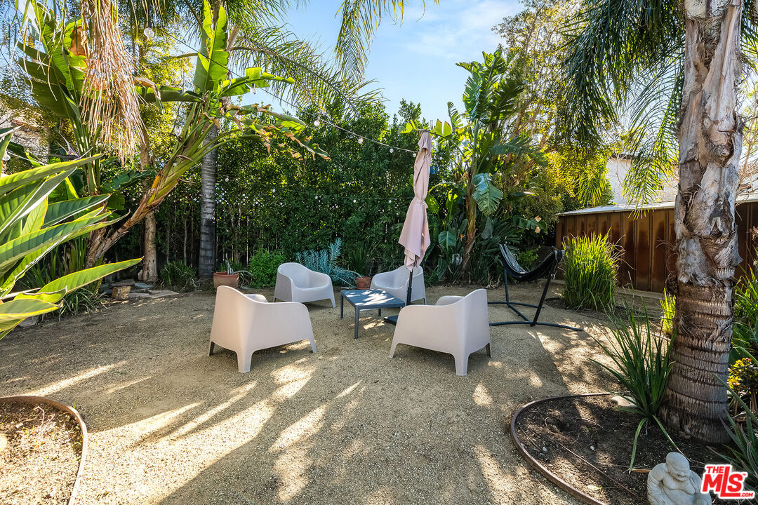 6660 Amigo Avenue Reseda, CA 91335 - Photo 14 of 25 a view of backyard with couches and potted plants
