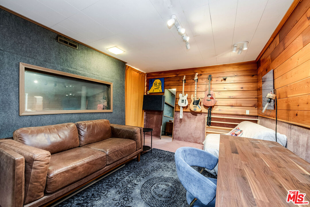 6660 Amigo Avenue Reseda, CA 91335 - Photo 20 of 25 a living room with furniture and wooden floor