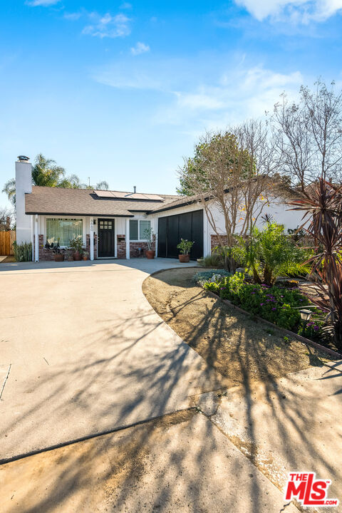 6660 Amigo Avenue Reseda, CA 91335 - Photo 2 of 25 a view of house with yard and sitting area